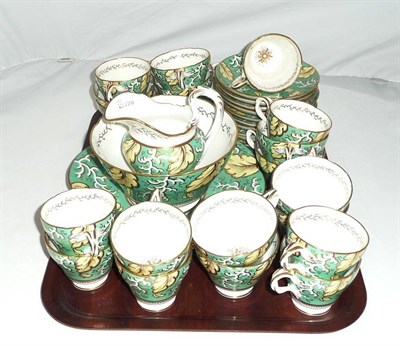 Lot 17 - An English Porcelain Tea and Coffee Service, circa 1850, each piece decorated with broad bands...