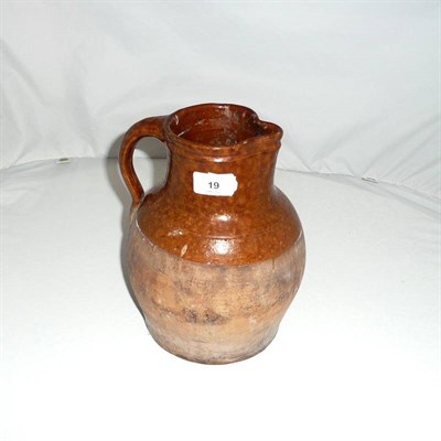 Lot 19 - A West Country Pottery Ale Jug, 19th century, of bulbous form with upper shoulder and neck with...