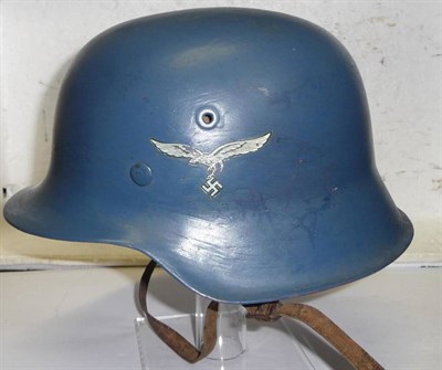 Lot 152 - A German M42 Helmet, with later blue paint and Luftwaffe double decals, the left inner brim stamped