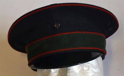 Lot 161 - A First World War Peaked Cap, possibly German, of black wool with red piping, green band and...