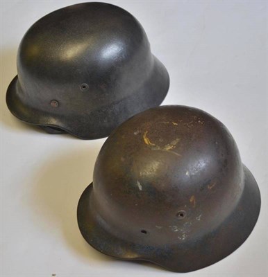 Lot 165 - A German M35 Helmet, with dark grey body, the inner rim with indistinct number, original nine...