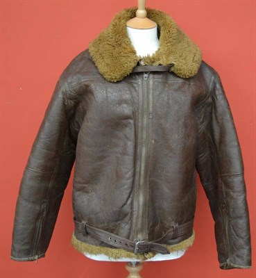 Lot 170 - A Second World War RAF Sheepskin Flying Jacket, the front zip fastener lacking its pull, one...