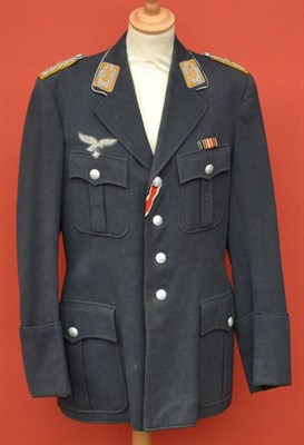 Lot 180 - A German Third Reich Luftwaffe Officer's Tunic, with four button front fastening, four pleated...