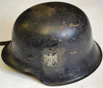 Lot 181 - A German Third Reich M42 Army Helmet, the slightly crizzled black painted skull with single...