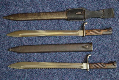 Lot 243 - A German 1898-05 NCO's Butcher Bayonet, First Pattern, the saw back steel blade stamped with a...