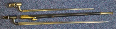 Lot 244 - A British 1876 Pattern Martini Henry Socket Bayonet, with brass mounted leather scabbard; a British