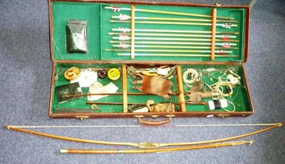 Lot 280 - A Mid 20th Century Archery Set, comprising a Seefab metal bow (damaged), ten US...