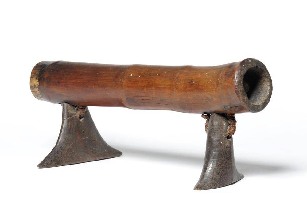 Lot 421 - A Tongan Headrest (Kali Toloni), the bamboo pole pillow with incised Scrimshaw type decoration...