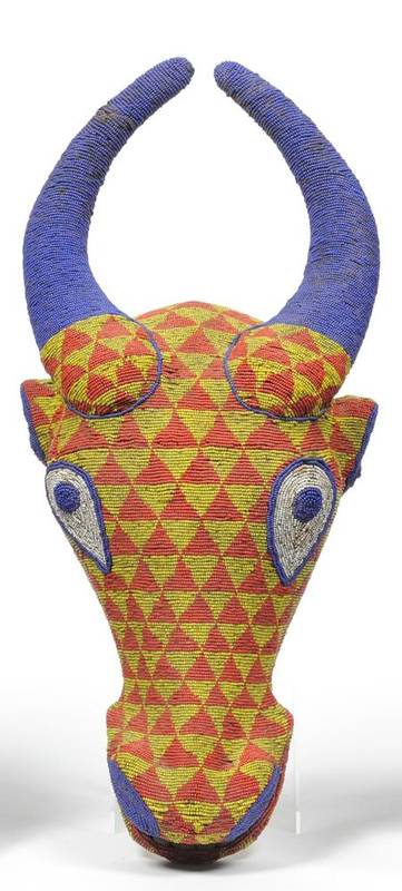 Lot 453 - A Bamileke Wood Cow Headdress, Cameroon, with curved horns and open mouth with carved teeth,...