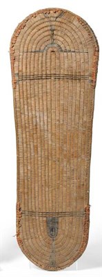 Lot 468 - A Solomon Islands Wicker Shield, of classical tapering oblong form, woven in very tight...
