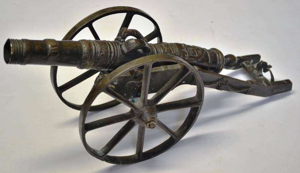 Lot 553 - A Bronze Model of a 17th Century Spanish Cannon, the 32cm barrel cast with a coat of arms and...