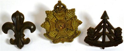 Lot 92 - Three Bakelite Cap Badges, by A Stanley & Sons, Walsall, with brass tangs, comprising...