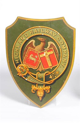 Lot 115 - A Highland Railway Company Coat of Arms, on a green painted shield shaped wooden plaque