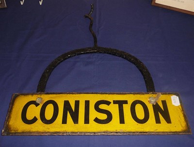 Lot 116 - An Enamelled Coniston Name Plate, black lettering on yellow ground, mounted on a wrought iron...