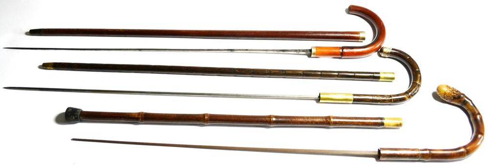 Lot 432 - A Malacca Swordstick, the 68cm square tapering steel blade with indistinct markings, silver collar