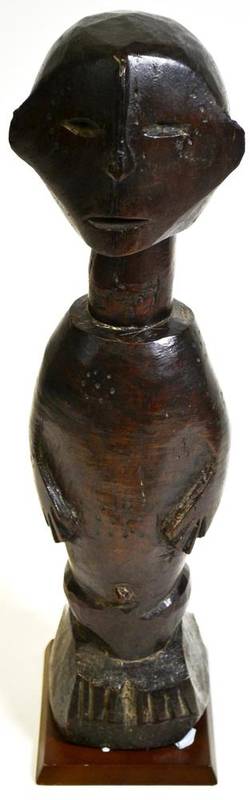 Lot 535 - A South Sea Islands Ancestor Figure, possibly Sumba, of dense hardwood, the large round head,...