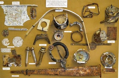 Lot 54 - A Display of Parts from a Crashed Spitfire Mark I, Serial No.X4423, including instrument faces,...