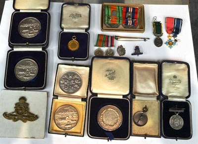 Lot 131 - A Collection of Medals and Badges, comprising a Second World War pair of Defence and War Medals...