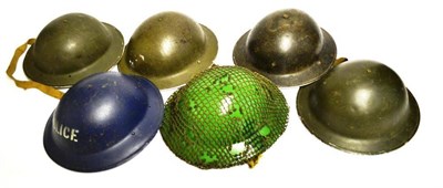 Lot 183 - A Collection of Six Second World War Brodie Helmets;- one painted apple green with camouflage...