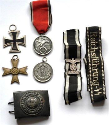 Lot 204 - A German Third Reich SS Long Service Medal, four years; a War Merit Cross, a copy of an Iron...