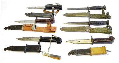 Lot 267 - Four AKM Type I Bayonets, two with steel scabbards, one with steel scabbard and leather frog,...