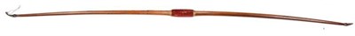 Lot 270 - A Victorian Yew Wood Longbow by Madle, Frith Street London, embossed with maker's name, the crimson