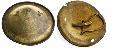 Lot 304 - A 19th Century Ethiopian Elephant/Rhinoceros Hide Shield, of deep convex circular form, with...