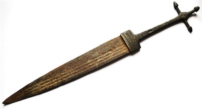 Lot 313 - A 19th Century Tuareg Telek Dagger, the 27.5cm double edge steel blade with three narrow fullers to