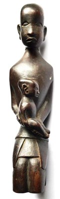 Lot 328 - A 20th Century African Hardwood Maternity Figure, as a mother with delicately carved features,...