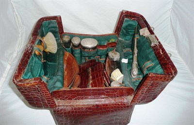 Lot 173 - A Brown Leather Crocodile Effect Travelling Vanity Case, circa 1900, the composite contents...