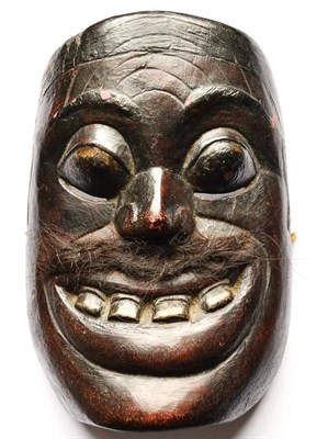 Lot 337 - A Kalimantan Wood Mask, Borneo, of rounded square form, with incised forehead, rounded eyelids...