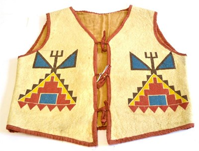 Lot 339 - A 20th Century North American Indian Waistcoat, of cream felted wool, with red cotton binding...