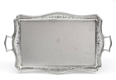 Lot 174 - An Edward VII Tea Tray, Goldsmiths & Silversmiths Co Ltd, London 1904, of serpentine edged...