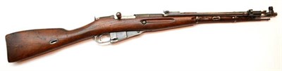 Lot 469 - A Deactivated Mosin Nagant Bolt Action Carbine, numbered AH4769, with beech full stock and...