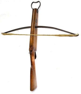 Lot 470 - An 18th Century European Hunting Crossbow, the curved steel bow with 79cm span and passed through a