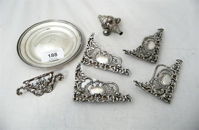 Lot 188 - A Set of Four Victorian Menu Holders, maker's mark HA, Birmingham 1893, each of scroll cast and...