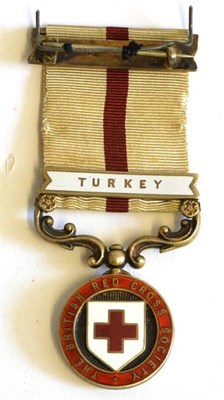 Lot 3 - A Rare British Red Cross Society Balkan War Medal, in silver gilt and enamel, with clasp TURKEY and