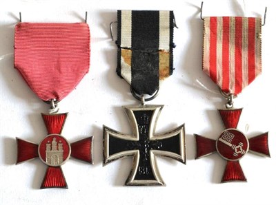 Lot 17 - Three German First World War Medals, comprising an Iron Cross, second class, a Hanseatic Cross...