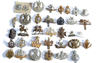 Lot 97 - A Collection of Thirty Four Military Badges, including cap, glengarry and collar, in white...