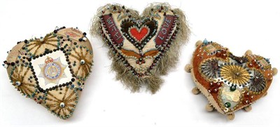 Lot 112 - Three First World War Sweetheart Pincushions, each of heart shape, set with printed and silk...