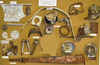 Lot 124 - A Display of Parts from a Crashed Spitfire Mark I, Serial No.X4423, including instrument faces,...