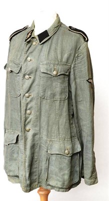 Lot 195 - A German Third Reich SS Combat Field Blouse, in grey/green herringbone twill, the fold-down...