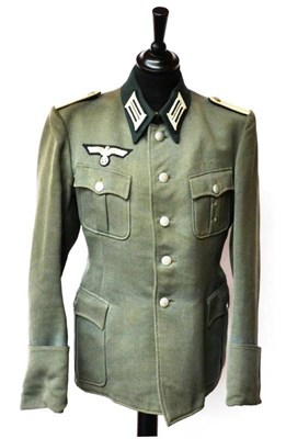 Lot 197 - A German Third Reich Service Tunic to a Leutnant, in field grey wool twill, with dark green collar