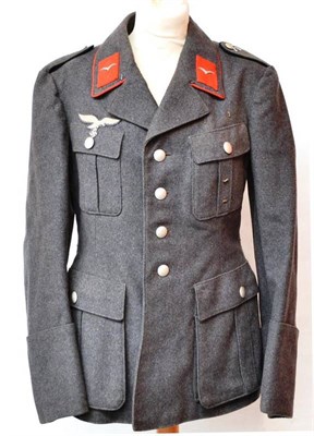 Lot 200 - A German Third Reich Kriegsmarine Double Breasted Tropical Reefer Jacket, the deep lapels with...