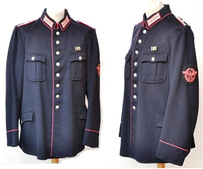 Lot 202 - A German Third Reich Fire Policer Officer's Tunic, in dark blue wool with pink piping, pink and...