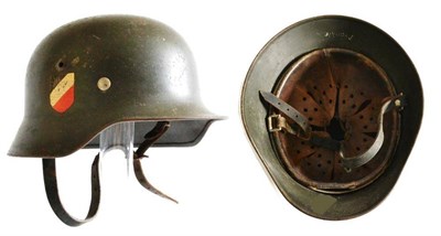 Lot 211 - A German Third Reich Double Decal M35 Army Helmet, the left inner brim stamped Q64, the back...