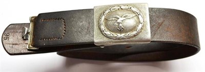 Lot 215 - A German Third Reich Luftwaffe OR's Belt Buckle, in silver washed aluminium, on a leather waist...