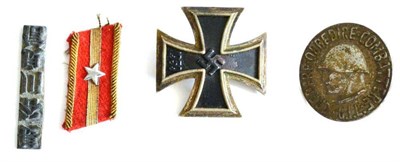 Lot 235 - A German Third Reich Iron Cross, 1st Class, the back with maker's mark L/11, with sword shape...