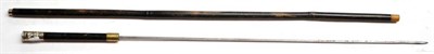 Lot 284 - A Bamboo Swordstick, with 59.5cm square section steel blade, the ebonised wood grip with brass...