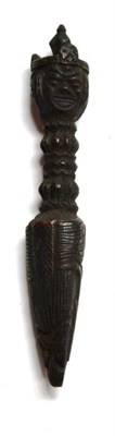 Lot 359 - A Tibetan Carved Wood Phurba (Ritual Dagger), of triangular section, the pommel carved on three...